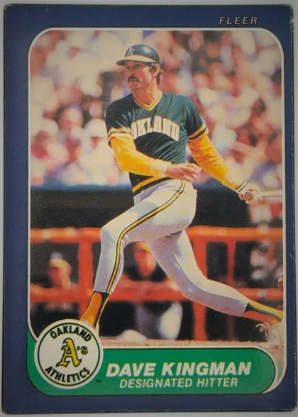 Front of 1986 Fleer Baseball Cards DAVE KINGMAN #423 Base, front of a baseball card with a solid navy-blue border. The top-right corner shows the white 'FLEER' brand mark. The central action photograph shows…