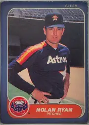 Front of 1986 Fleer Baseball Cards NOLAN RYAN #310 Base, portrait baseball card front. A Houston Astros player in a dark Astros uniform and cap stands on a baseball field. FLEER is printed at the upper…