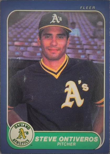 Front of 1986 Fleer Baseball Cards Steve Ontiveros #429, portrait baseball card showing Steve Ontiveros in an Oakland Athletics uniform and cap, centered against a stadium background. The top-right area…