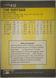 Back of 1986 Fleer Baseball Cards Tim Birtsas #412, back of a portrait-oriented baseball card. A dark charcoal-gray header contains the white FLEER brand and card number 412 at upper left. Below it, a…