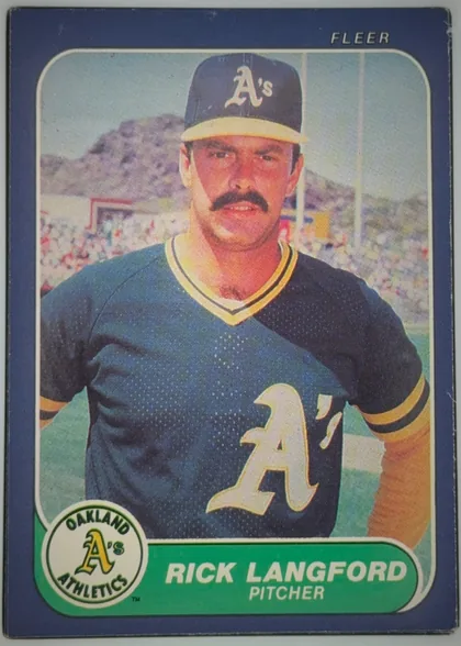 Front of 1986 Fleer Rick Langford #425 Base, portrait-oriented baseball card front. A color portrait of a mustached Oakland Athletics player in uniform fills the central image. FLEER is printed…