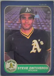 Front of 1986 Fleer Steve Ontiveros #429 Base Card, front of a baseball card. A medium-blue border frames a rounded-rectangle color photograph of a player in a dark navy Oakland Athletics jersey with…