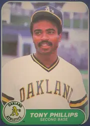 Front of 1986 Fleer Tony Phillips #430 Base, front of a baseball card. A color head-and-shoulders portrait of a player wearing an Oakland Athletics home uniform: white jersey with arched…
