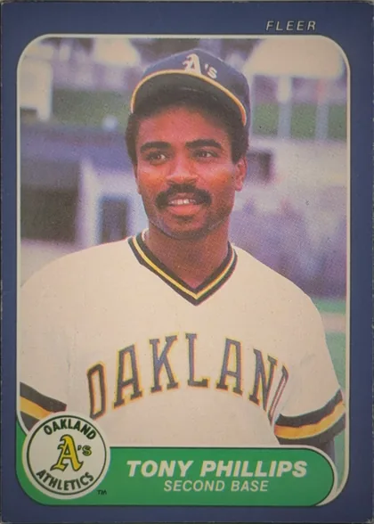 Front of 1986 Fleer Tony Phillips #430 Base, portrait-oriented baseball card front. A color portrait of a player in an Oakland Athletics uniform fills the central image area. The player wears a…