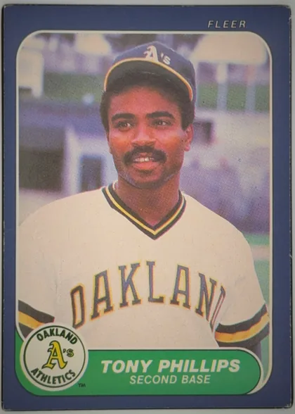 Front of 1986 Fleer TONY PHILLIPS #430 Base, portrait baseball card front. A close-up photograph shows Tony Phillips in an Oakland Athletics uniform. FLEER is printed at the upper right. The…