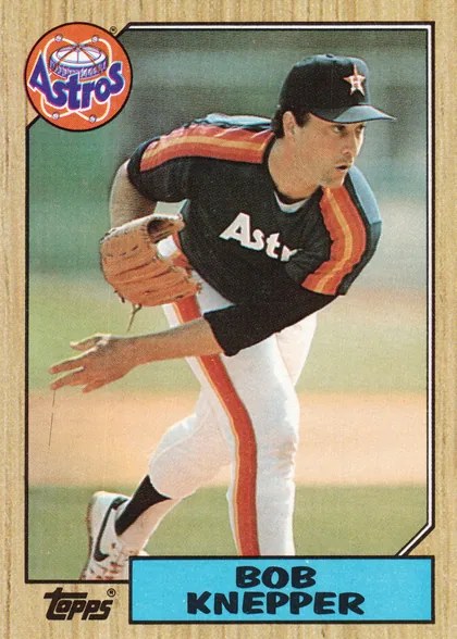 Front of 1987 Topps Baseball BOB KNEPPER • PITCHER #722, upright portrait baseball card front. A pitcher in a Houston Astros uniform is shown in action against a green field background. The circular Astros…