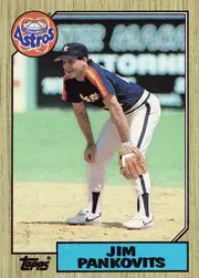 Front of 1987 Topps Baseball Jim Pankovits #249 Base, portrait baseball card front. A color photograph shows Jim Pankovits pitching in a Houston Astros uniform. The upper-left corner contains a large…