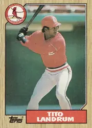 Front of 1987 Topps Baseball Tito Landrum #288 Base, upright portrait baseball card front. A full-height color action photograph shows a Cardinals outfielder in a red home uniform, white pants and red…