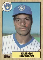 Front of 1987 Topps Glenn Braggs #622 1987 Topps Baseball (flagship base, #397-792 series-2 printing), portrait-oriented baseball card front. A large close-up color portrait of Glenn Braggs in a Milwaukee Brewers cap and white pinstriped uniform fills…