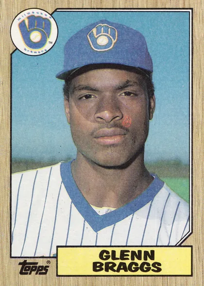 Front of 1987 Topps Glenn Braggs #622 1987 Topps Baseball (flagship base, #397-792 series-2 printing), portrait-oriented baseball card front. A large close-up color portrait of Glenn Braggs in a Milwaukee Brewers cap and white pinstriped uniform fills…