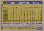 Back of 1987 Topps Rick Honeycutt #753 Base, landscape-oriented baseball card back. A blue header contains the yellow card number 753 at upper left, the large player name RICK HONEYCUTT, and…