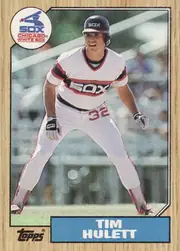 Front of 1987 Topps Tim Hulett #566 Base, portrait baseball card front. A player in a white Chicago White Sox uniform is shown in an action pose against a stadium background. The circular…
