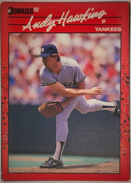 Front of 1990 Donruss Andy Hawkins #159, portrait-oriented baseball card front. A black Donruss logo with a baseball icon and white "90" appears at the upper left. The prominent player name…