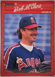 Front of 1990 Donruss Baseball Bob McClure #470 Base, portrait-oriented baseball card front. A red header and outer border surround a large color portrait of Bob McClure in an Angels uniform and cap…