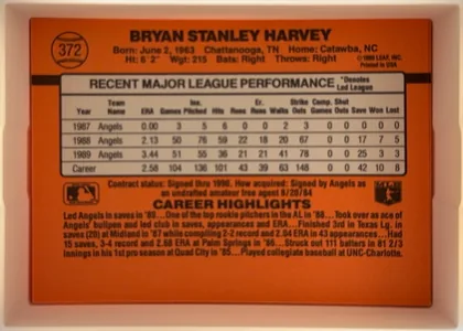 Back of 1990 Donruss Baseball Bryan Harvey #372, landscape-oriented baseball card back. An orange-red field surrounds a centered light gray statistics table with black outlines and headings. The…