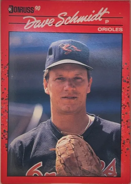Front of 1990 Donruss Baseball Dave Schmidt #524, front of a baseball card. Top-left shows the 'DONRUSS' wordmark with a stylized baseball 'D' and a superscript '90'. Across the top in white cursive…