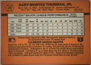 Back of 1990 Donruss Baseball Gary Thurman #416, upright landscape-format card back. An orange-brown background surrounds a large cream statistics panel. The upper-left contains a baseball-shaped…