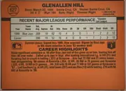 Back of 1990 Donruss Baseball Glenallen Hill #627, landscape-format orange baseball card back. The upper-left contains a baseball graphic with the number 627. Glenallen Hill is printed prominently…