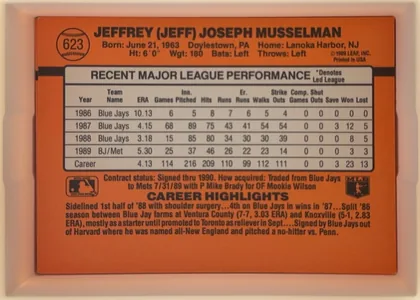 Back of 1990 Donruss Baseball Jeff Musselman #623, landscape-oriented orange baseball card back. The upper portion presents the player's full name in bold black type, with biographical details…