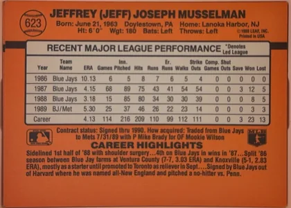 Back of 1990 Donruss Baseball Jeff Musselman #623, landscape-oriented orange baseball card back. The upper portion presents the player's full name in bold black type, with biographical details…