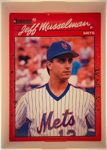 Front of 1990 Donruss Baseball Jeff Musselman #623, portrait-oriented baseball card front. The upper area has a red background with the Donruss logo and a large cream-colored script player name, Jeff…