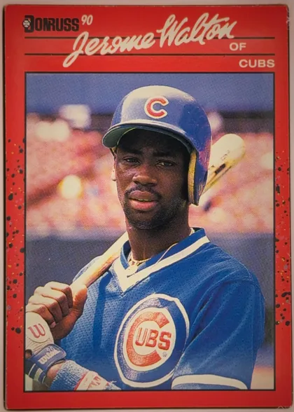 Front of 1990 Donruss Baseball Jerome Walton #285, portrait-oriented baseball card front. A red speckled border surrounds a large color photograph of Jerome Walton in a Chicago Cubs uniform holding a…