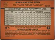 Back of 1990 Donruss Baseball Jerry Reed #614, landscape-oriented baseball card back. An orange field surrounds a large light-gray statistics table in the upper and middle portion. The player…