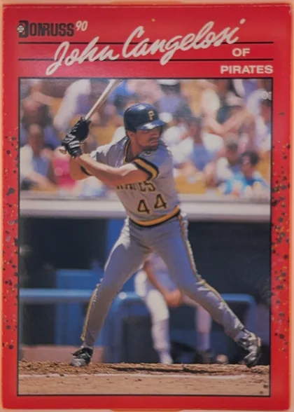 Front of 1990 Donruss Baseball John Cangelosi #565, portrait-oriented baseball card front. A red border surrounds a large action photograph of a Pittsburgh Pirates batter wearing uniform number 44…