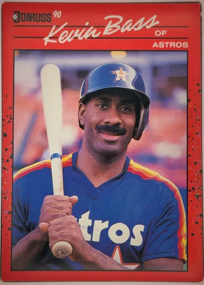 Front of 1990 Donruss Baseball Kevin Bass #589 Base, upright portrait-format baseball card front. A red border surrounds a large color photograph of Kevin Bass in an Astros uniform holding a bat. The…
