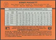 Back of 1990 Donruss Baseball Kirby Puckett #269 Base, upright landscape-oriented baseball card back. The orange field carries a large bold black KIRBY PUCKETT heading across the top, with a…