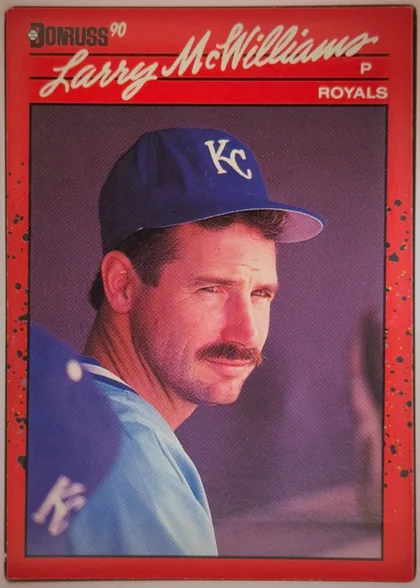 Front of 1990 Donruss Baseball Larry McWilliams #709 Base, portrait-oriented baseball card front. The upper left has a Donruss logo and "90"; the large white script player name "Larry McWilliams" spans the…