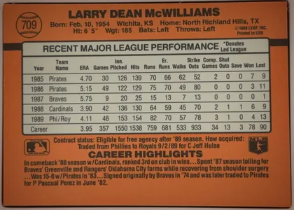 Back of 1990 Donruss Baseball Larry McWilliams #709 Base, landscape-oriented baseball card back with an orange-brown field. The player name appears prominently across the top, with card number 709 inside a…