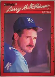 Front of 1990 Donruss Baseball Larry McWilliams #709 Base, upright portrait-format baseball card front. A red border surrounds a large color portrait of Larry McWilliams in a Kansas City Royals uniform and…