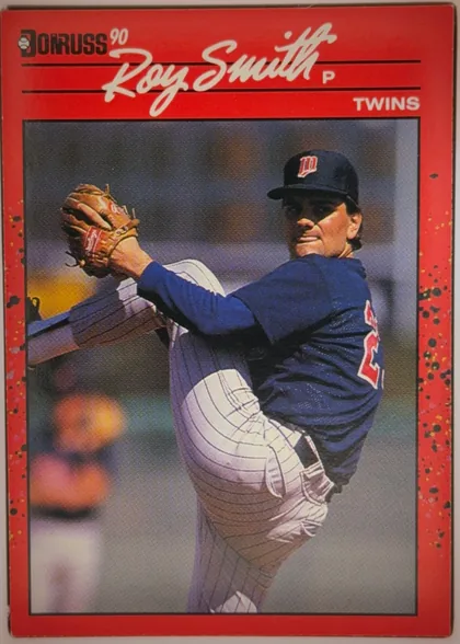 Front of 1990 Donruss Baseball Leroy (Roy) Purdy Smith III #273, upright portrait baseball card front. A large red speckled border surrounds a central action photograph of a pitcher in a Minnesota Twins uniform…