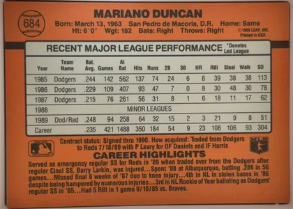 Back of 1990 Donruss Baseball Mariano Duncan #684, landscape-oriented baseball card back dominated by an orange field. A baseball-shaped number emblem containing 684 appears at upper left. Mariano…