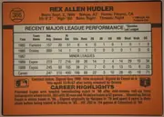 Back of 1990 Donruss Baseball Rex Allen Hudler #366, upright landscape-oriented baseball card back with an orange field and black perimeter border. A baseball graphic containing the number 366 appears…