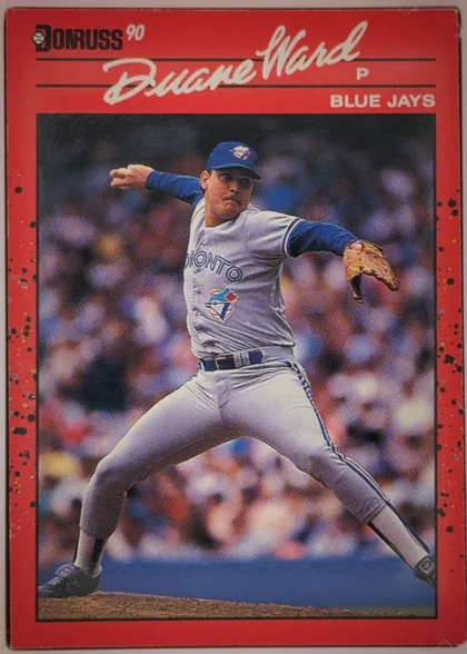 Front of 1990 Donruss Baseball ROY DUANE WARD #307, portrait-oriented baseball card front. A large white script player name, "Duane Ward," spans the upper red header. The upper-left contains the black…