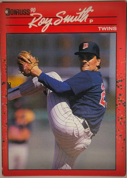Front of 1990 Donruss Baseball Roy Smith #273 Base, portrait-oriented baseball card front. A red distressed border surrounds a large photograph of a pitcher in a Minnesota Twins uniform. The…