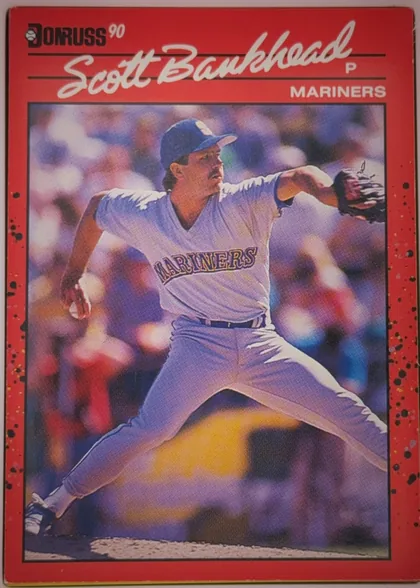 Front of 1990 Donruss Baseball Scott Bankhead #261, portrait-oriented baseball card front. A black-and-white DONRUSS logo and “90” appear at the upper left. The large white script name “Scott…
