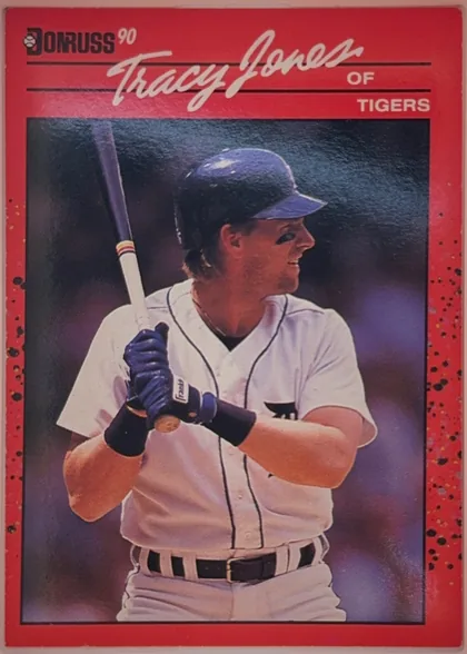 Front of 1990 Donruss Baseball Tracy Jones #636, portrait baseball card front. A red header and border surround a large color photograph of Tracy Jones batting in a Tigers uniform. The Donruss logo…