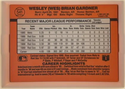 Back of 1990 Donruss Baseball Wes Gardner #541, landscape-oriented baseball card back with an orange background. The upper-left contains a baseball-shaped number medallion with 541. The player…