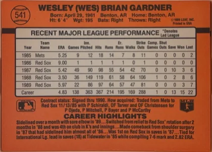 Back of 1990 Donruss Baseball Wes Gardner #541, landscape-oriented baseball card back with an orange background. The upper-left contains a baseball-shaped number medallion with 541. The player…