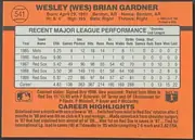 Back of 1990 Donruss Baseball Wes Gardner #541 Base, landscape-oriented baseball card back dominated by an orange field. A circular baseball graphic at upper left contains the number 541. The player's…