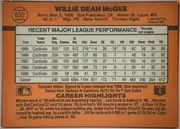 Back of 1990 Donruss Baseball WILLIE DEAN McGEE #632, landscape-oriented baseball card back with an orange-brown background. The player's name is printed prominently across the top, with biographical…