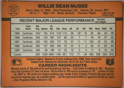 Back of 1990 Donruss Baseball WILLIE DEAN McGEE #632, landscape-oriented baseball card back with an orange-brown background. The player's name is printed prominently across the top, with biographical…