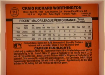 Back of 1990 Donruss Craig Worthington #141, orange baseball card back oriented upright. The upper area has a baseball icon containing card number 141 at left and the large player name CRAIG…