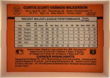Back of 1990 Donruss Curt Wilkerson #608, landscape-oriented baseball card back. An orange-red field surrounds a large white statistics table headed RECENT MAJOR LEAGUE PERFORMANCE. The…