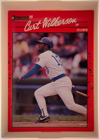 Front of 1990 Donruss Curt Wilkerson #608, portrait baseball card front. A Donruss logo and "90" appear at the upper left. The large white script name "Curt Wilkerson" spans the top over…