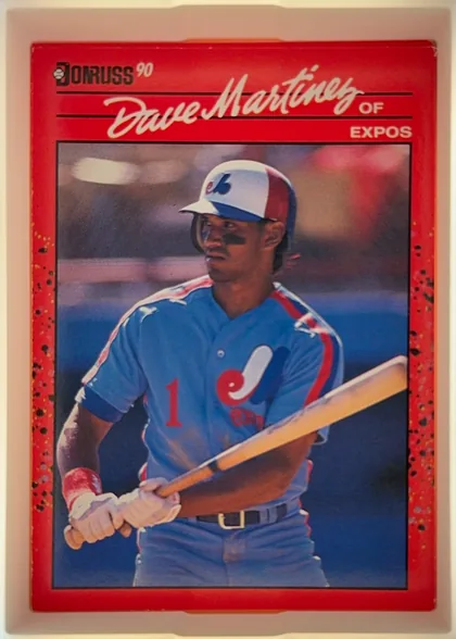 Front of 1990 Donruss Dave Martinez #452, upright portrait baseball card. A black-and-white Donruss logo and "90" appear at the upper left. The player name "Dave Martinez" is printed…
