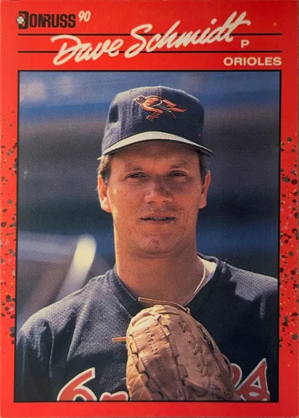 Front of 1990 Donruss Dave Schmidt #524, portrait baseball card front. The red header contains the Donruss logo and "90" at upper left. The player's name, "Dave Schmidt," appears in large…